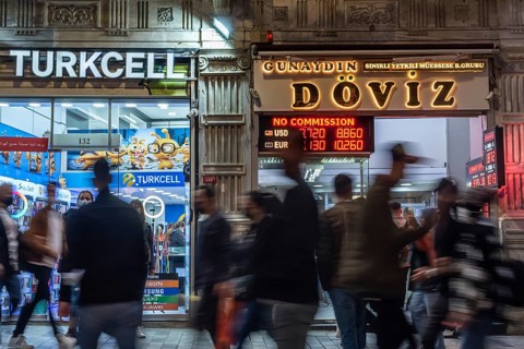 Istanbul, Turkey. October 5th 2021 Blurred people moving in front of a currency exchange office on