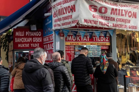 Istanbul, Turkey. December 27th 2021 Turkish men and women queue to buy Milli Piyango tickets, the