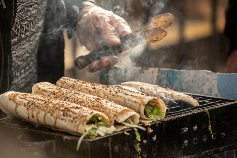 Istanbul, Turkey. November 29th 2020 Grilled fish wrap sandwiches cooking on a stall outside in