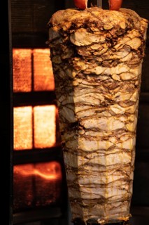 Istanbul, Turkey. November 30th 2020 Layers of Turkish Kebab meat cooking on a skewer in Istiklal