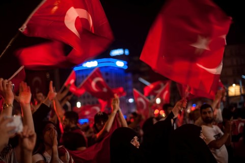 Istanbul, Turkey. July 19th 2016 Turkish pro government supporters in Taksim square waving flags