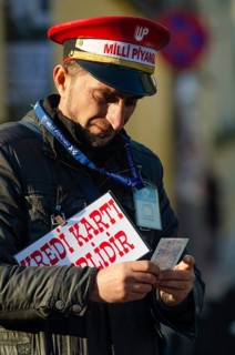 Istanbul, Turkey. December 19th 2014 A man selling Turkish lottery tickets near Takism square,