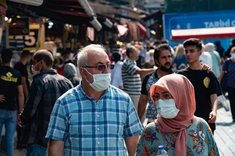 Istanbul, Turkey 25th August 2021 A Turkish couple wearing protective face masks in a busy market