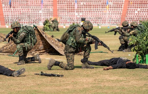 Personnel of the Central Reserve Police Force simulate a counter-terror operation, as they