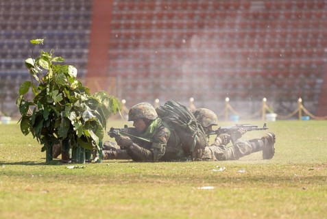 Personnel of the Central Reserve Police Force simulate a tactical operation as he taking position