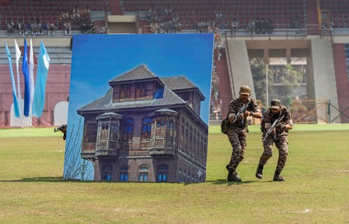 Personnel of the Central Reserve Police Force simulate an urban counter-terror operation, as they