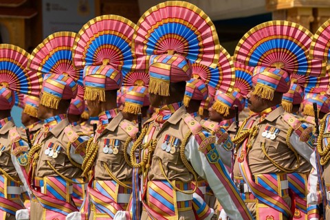 Central Reserve Police Force (CRPF) personnels march in ceremonial formation during a parade held