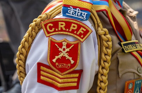 The ceremonial insignia and braided cord on the uniform of a personnel of the Central Reserve