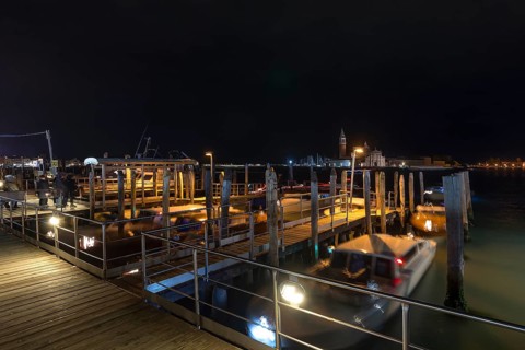 San Marco night-time boat dock, in the back the island of Saint Giorgio Maggiore, Venice, Veneto,