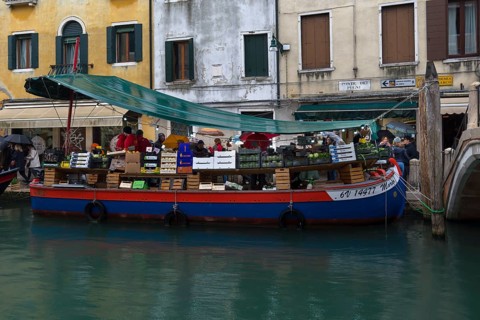 Selling fruit and vegetables on a boat, Venice, Veneto, Italy