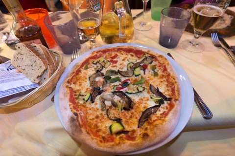 Vegetarian pizza in a restaurant, Italy