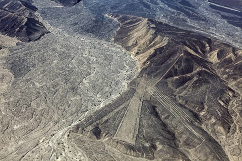 Wide mountain and desert area with recognizable Nazca lines in Peru, the geoglyphs and images in