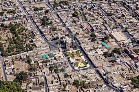 Aerial view of a city with clearly visible roads and buildings, details of urban planning visible,