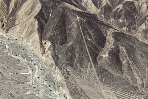 Aerial view of hills with recognizable geometric lines in the desert, the geoglyphs and images in