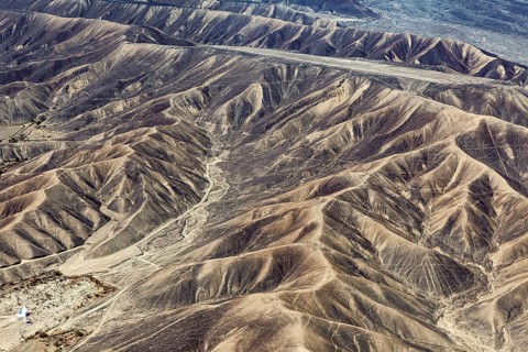 Barren range of hills with erosion-shaped structures in a dry environment, the desert landscape