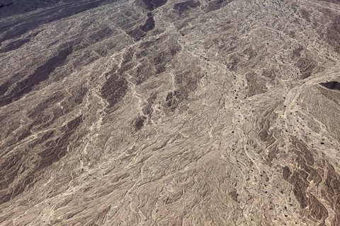 Detailed illustration of a dry riverbed with complex earth formations and exemplary textures in a