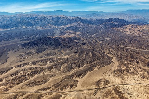 Extensive mountainous desert landscape with barren hills and valleys, the desert landscape near