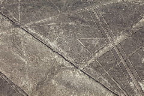 Aerial view of lines and patterns on a dry desert surface, the geoglyphs and drawings in the desert