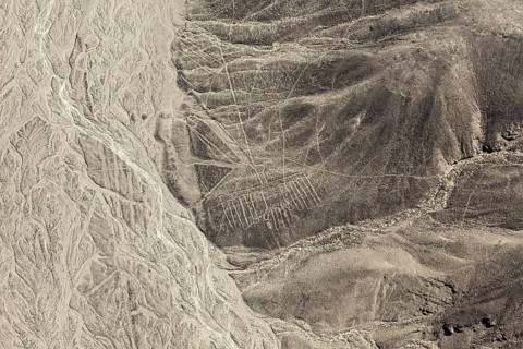 Impressive lines and shapes stretch across the barren mountain flank, the geoglyphs and paintings