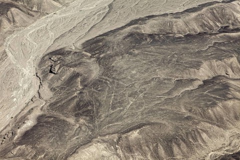 Dry desert with puzzling lines that cover the mountain and form geometric figures, the geoglyphs