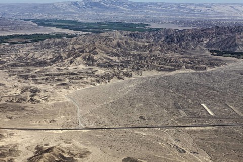 Wide desert-like landscape with mountains and valleys up to the horizon, the desert landscape near