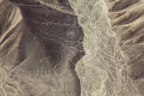 Hilly desert view with ancient lines and patterns, the geoglyphs and paintings in the desert near