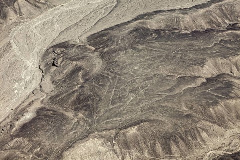 Wide expanse of a barren and dry landscape with eye-catching line patterns, geoglyphs and drawings