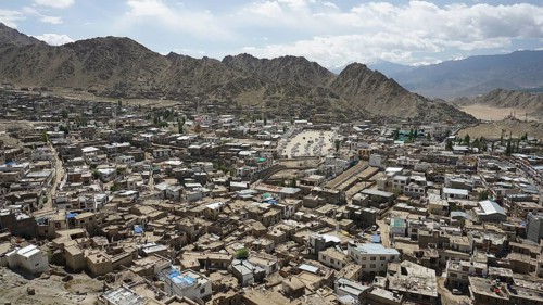 City view from Leh Palace over Leh with mountains and cloudy sky, Ladakh, North India, Himalayas,