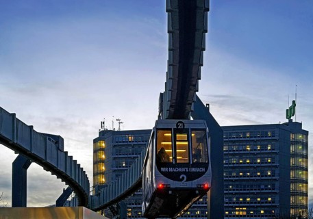 The H Bahn, an automatically controlled large cabin suspension railway in front of the Mathetower