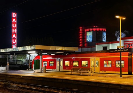 Local train at Oberbamen station with gas boiler at night, Wuppertal, North-Rhine Westphalia,