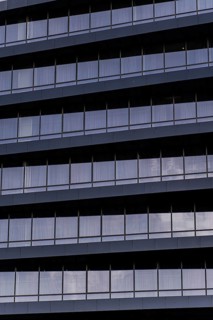 A detailed close-up showcasing the modern architectural design of a building's exterior. The image