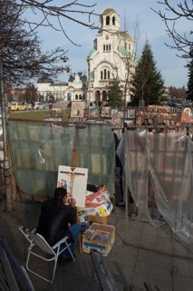 Sofia, Bulgaria, February 6th 2018 Artist painting religious image outside Alexander Nevsky