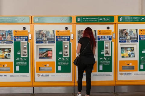 Budapest, Hungary. October 1st 2023 A woman buying a train ticket from an automatic machine at