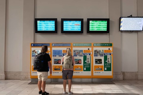 Budapest, Hungary. October 1st 2023 Tourists buying a train tickets from automatic machines at