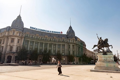Bucharest, Romania. October 29th 2023. A woman walks past the Banca Comerciala Romana, (BCR) a