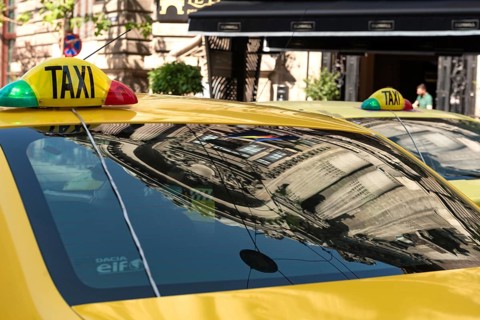 Bucharest, Romania. October 29th 2023. Romanian Taxi cabs parked outside a popular restaurant in