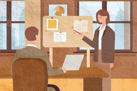 Two professionals engage in a discussion within a modern office One outlines ideas on a
