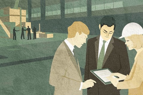Three professionals consult over a tablet in a warehouse, surrounded by stacks of boxes Colleagues