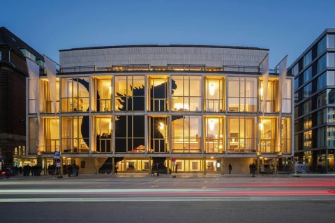 Hamburg State Opera (with Monster's Paradise façade) at blue hour with illuminated stripes of
