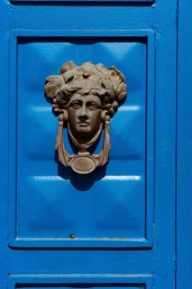 Bodrum, Mugla, Turkey. April 22nd 2022 Beautiful blue door with a Greek mythological icon as a door