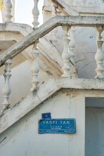 Bodrum, Mugla, Turkey. April 23rd 2022 Blue street sign for Vasfi Tan Sokak and traditional white