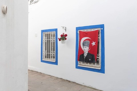 Bodrum, Mugla, Turkey. April 23rd 2022 Pretty blue painted windows in the charming side streets of