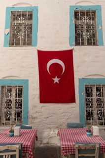 Bodrum, Mugla, Turkey. April 23rd 2022 Pretty cafe tables set against a beautiful pastel blue