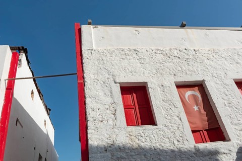 Bodrum, Mugla, Turkey. April 22nd 2022 Graphic architecture and red shuttered windows of