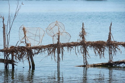 Reed fish traps and metal cages a typical method of fishing along the River Nile at Rosetta in the