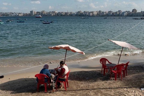 Alexandria, Egypt. December 1st 2022 An Egyptian couple sit on the receding Mediterranean beach of