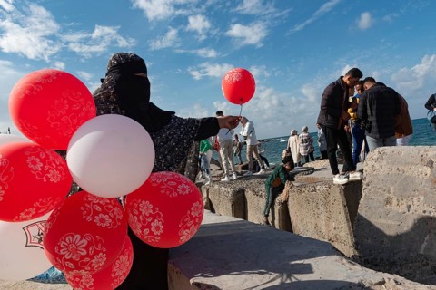 Alexandria, Egypt. December 3rd 2022 A Muslim woman wearing a black abaya and niqab selling