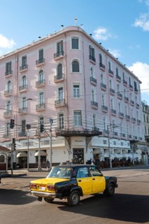 Alexandria, Egypt. December 4th 2022 Egyptian taxi passing the famous Trianon Cafe restaurant, Saad