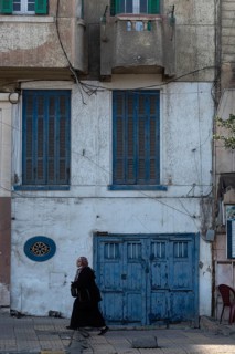 Alexandria, Egypt. December 3rd 2022. Blue painted doors and windows of faded traditional