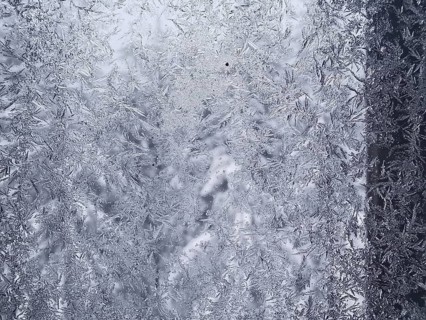 Close-up of a window with frozen ice forming intricate patterns, Frankenwald nature park Park